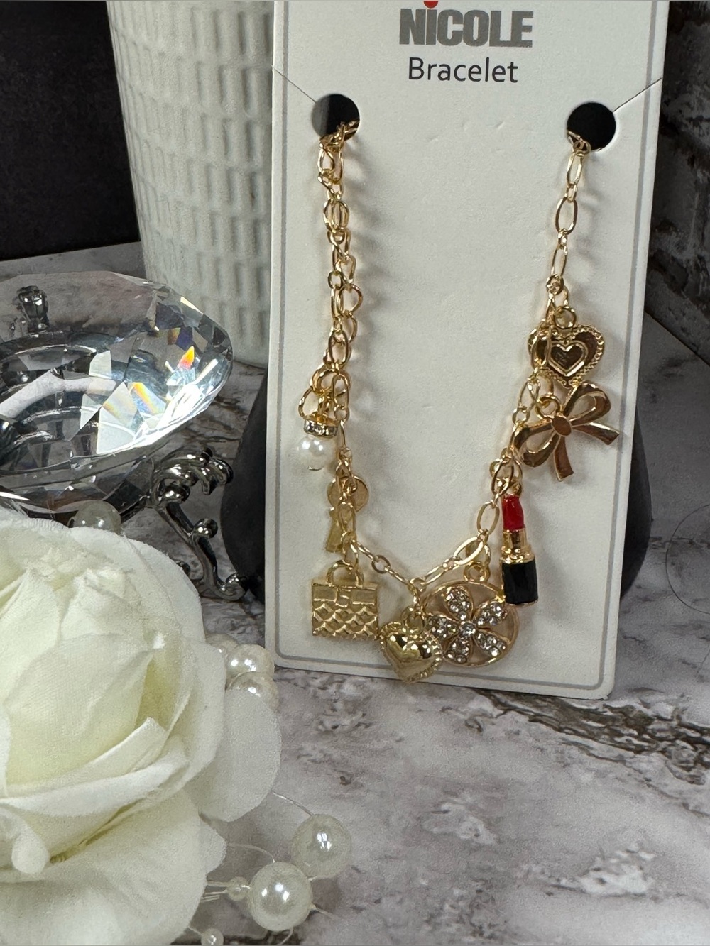 Nicole Gold Charm Bracelet with Red and Black Lipstick Accent